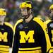 Michigan junior right wingman Luke Moffatt and other players react to failing to score in the third period of the game against Michigan Tech at Joe Louis Arena on Saturday, Dec. 29. The Wolverines lost 4-0. Daniel Brenner I AnnArbor.com